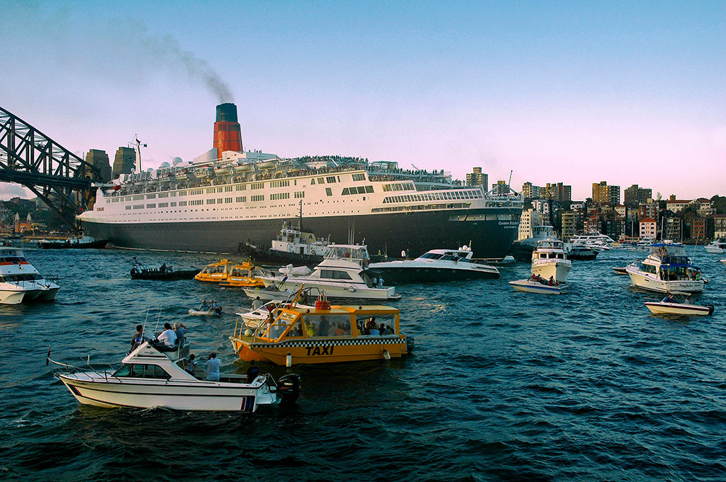  Queen Elizabeth 2 and welcoming flotilla. 