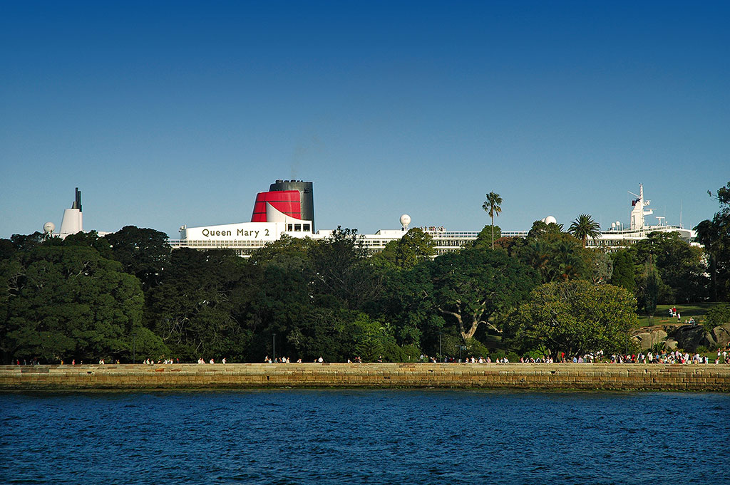  Queen Mary 2 towers over the Botanic Gardens, as seen from Farm Cove. 